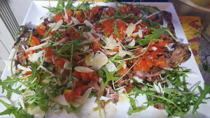 Tagliata di manzo con pomodorini, rucola e grana