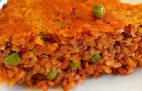 Timballo di riso al sugo con funghi e piselli