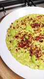 Risotto con crema di zucchine e speck tostato